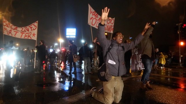 Ferguson women peacefully protest as city braces for decision