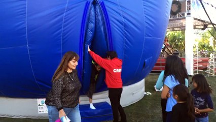 The blue monster is having kids! Giant balloon with a curious split (like a woman orifice)