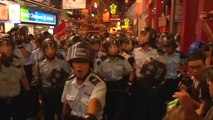 Protesters clash with riot police in Hong Kong