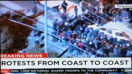 FERGUSON RIOTERS TURN OVER POLICE CAR AND SET IT ON FIRE.