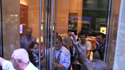 One Direction's Harry Styles leaves a Rolex store in NYC