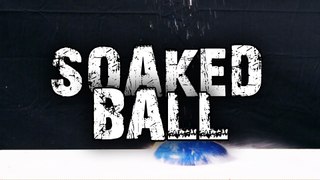 Soaked Foam Ball Smashes Against Pavement in Slow Motion