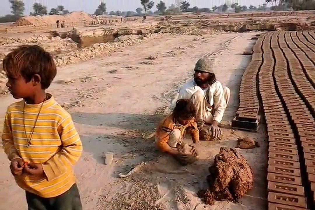 Patras masih and children making bricks