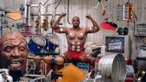 Terry Crews playing drums with muscles