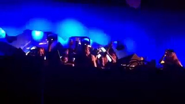 The DJ Richie Hawtin pushes monitor into fan recording his set