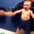8 months old son flexing with father