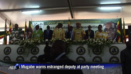 Mugabe warns estranged deputy at key party meeting