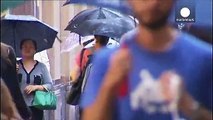 Unusual storms hit Sydney, typhoon threatening Philippines weakens