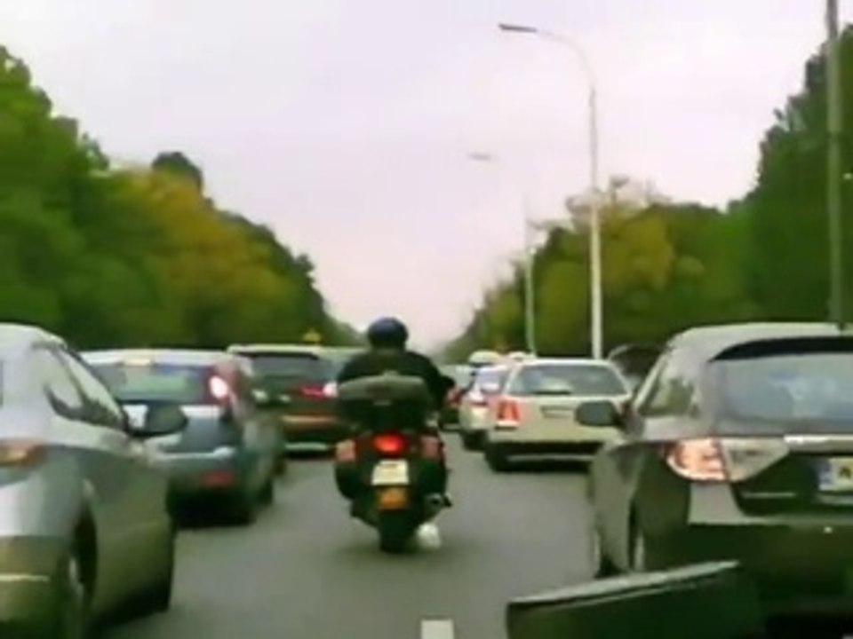 Driver Opens Door On Biker