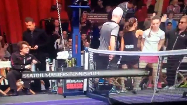 Elton John was NOT still standing after tumbling backward out of his chair at a tennis match