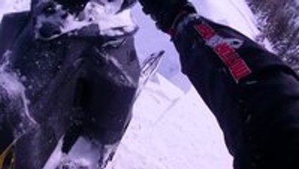 Guy nearly drives off a cliff on a snowmobile