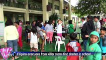Filipino storm evacuees find shelter in school