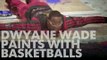 Dwyane Wade paints with basketballs