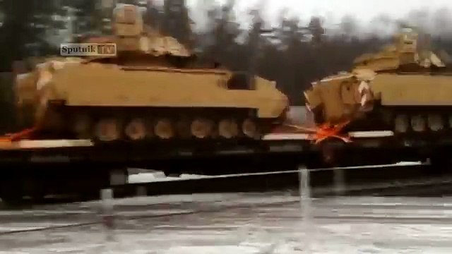 Train with tanks of the US Army drove through Latvia Lithuania (Bradleys a.k.a. infantry fighting vehicles. )