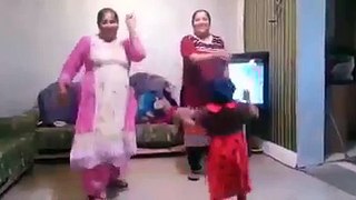 women dance in front of song video