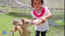 Little girl feeding baby deer | Gilgit-Baltistan