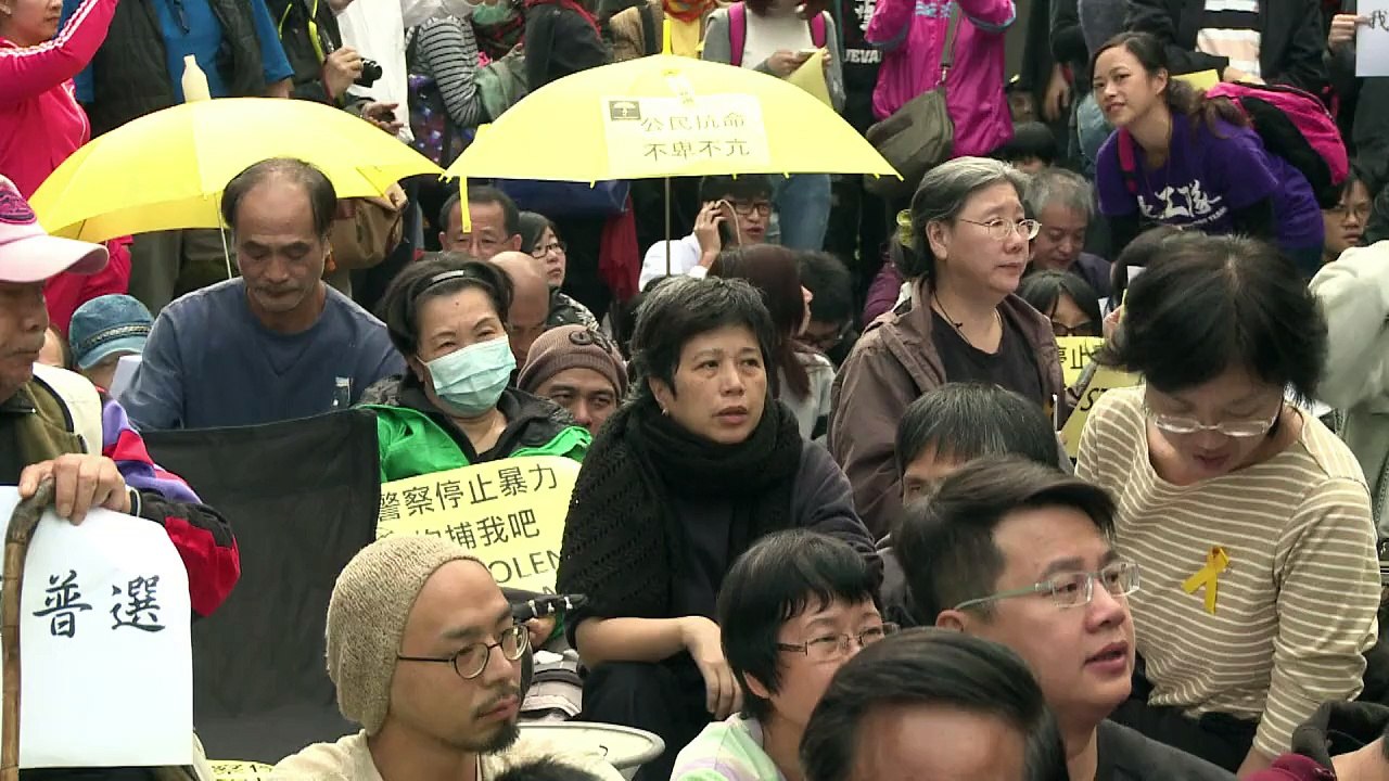 Hong Kong police haul away protesters from rally site