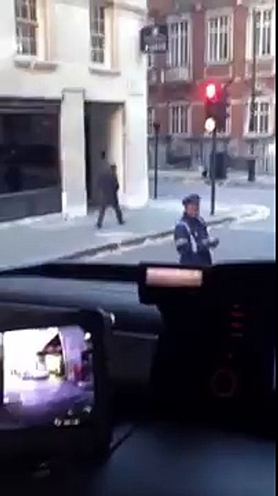 (100) Traffic warden trying to put a ticket on the window