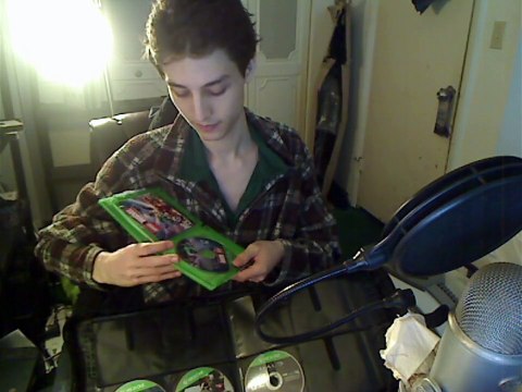 Xbox One Video Games Being Organized Into A DVD/CD Travel Case In Real Life