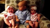 Adorably confused baby meets twins