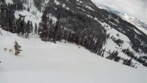 Skier Falls Off Huge Cliff