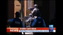 Hostages held in Sydney cafe, Islamic flag seen in window - local TV