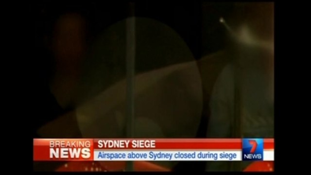 Hostages held in Sydney cafe, Islamic flag seen in window - local TV