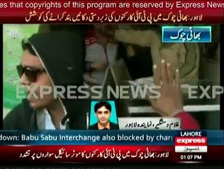 PTI workers ' scuffle with a motorcyclist in Lahore