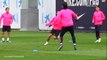 Luis Suarez pushes Gerard Pique during rondo in Barcelona training