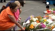 Flags fly at half-mast across Sydney after the violent end to a cafe siege