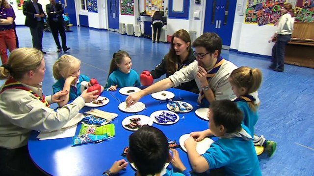 Kate decorates cupcake blindfolded during Scouts visit
