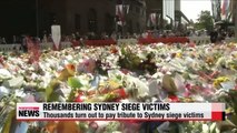 Thousands turn out to pay tribute to heroic Sydney siege victims