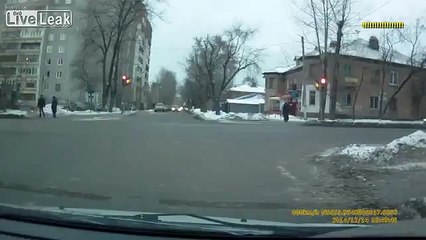 Policeman rides on hood of car