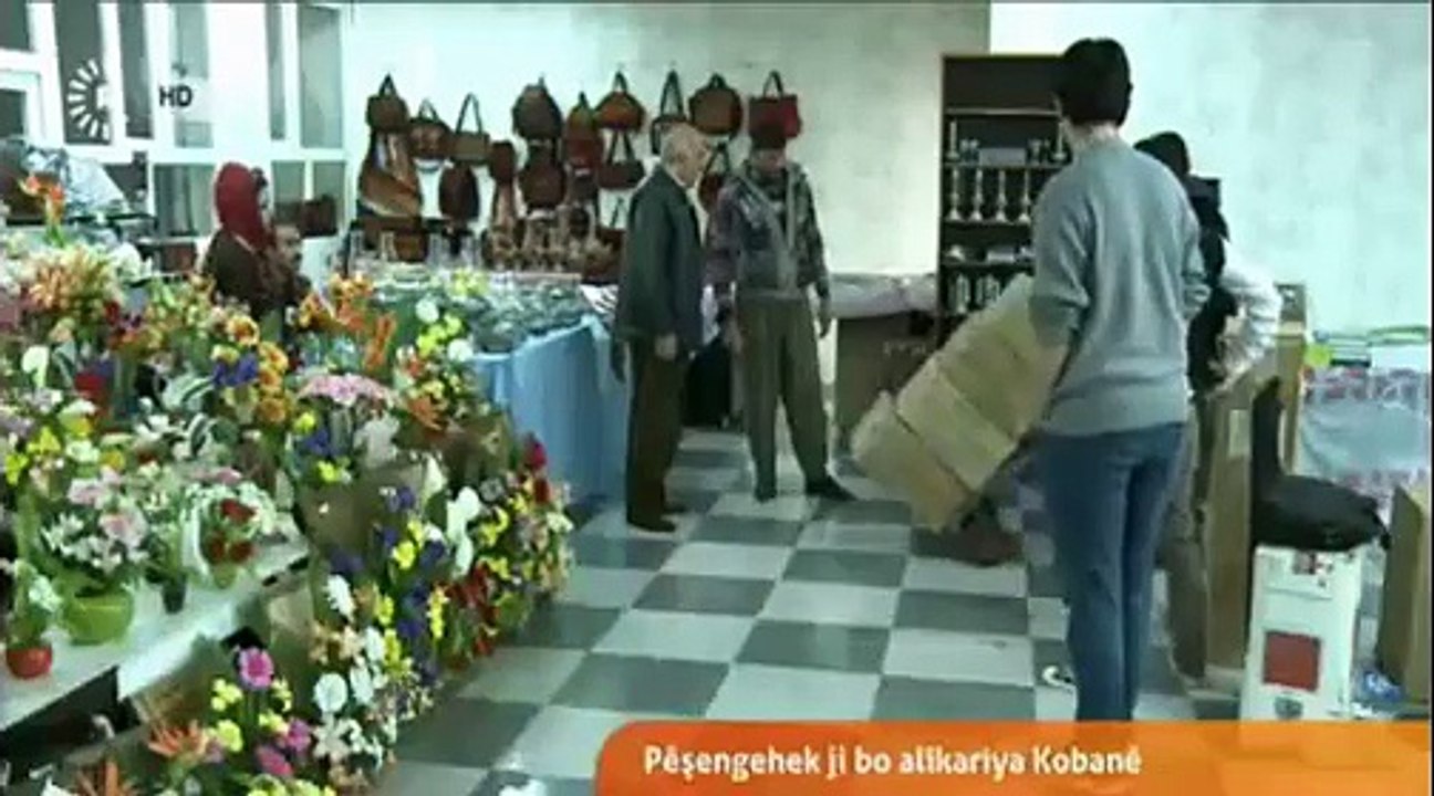 Pirtûkekê bikirre, Zarokekî ji birçîbûnê rizgar bike. Ji bo awareyên Kobaniyê. 15ê 12a 2014an. Rûdaw tv