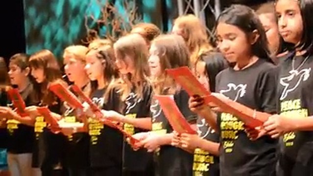 Children of an American School are giving tribute to the martyrs of the Peshawar attack in Pakistan