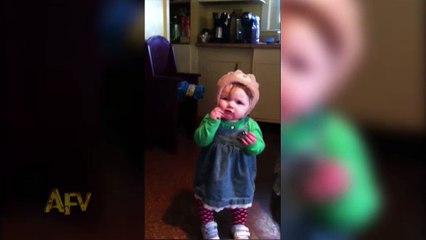 Baby Girl Gets Hat Stuck Over Her Eyes While Taking It Off