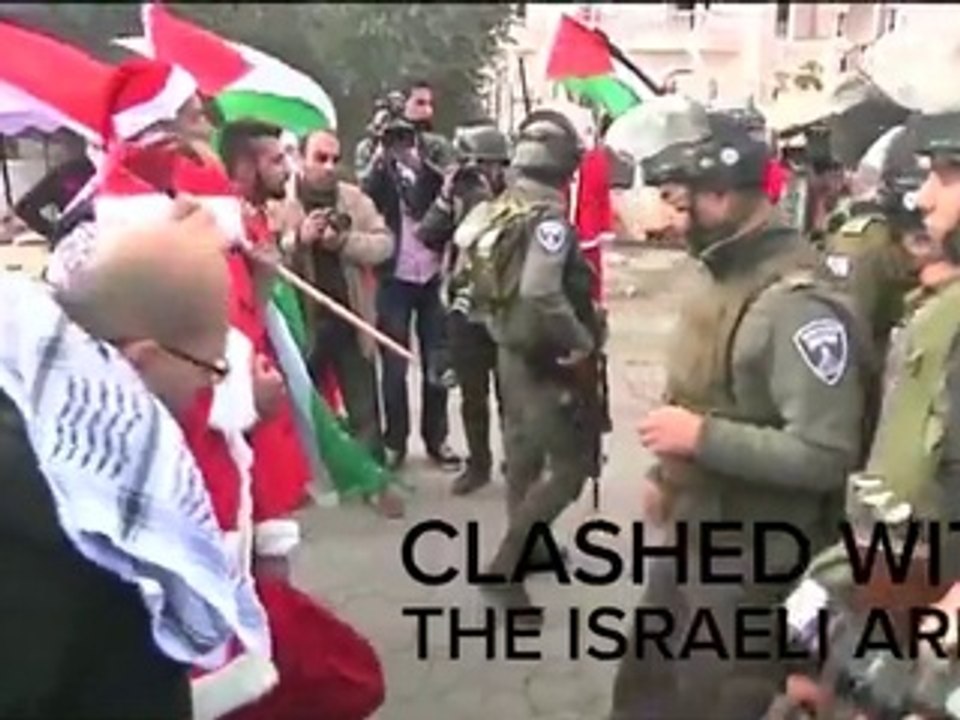 Israeli Soldiers Clash With Santa-Clad Palestinians