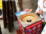 street food cotton candy making at  Ciqikou, Chongqing, China_(new)