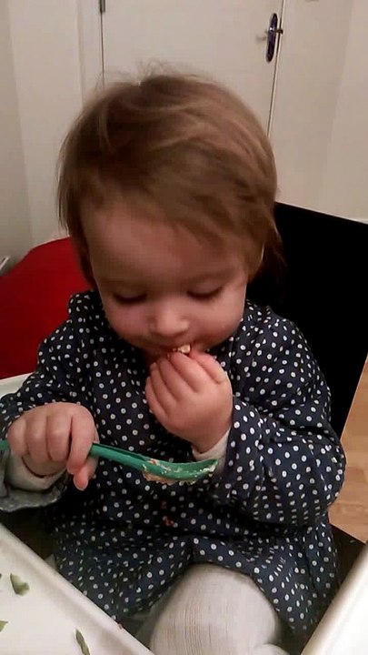 Teaching Lola to use a spoon. It hasn't gone swimmingly!