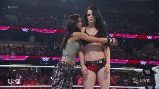 WWE RAW 2014 AJ Brooks as AJ Lee hugging Paige,plaid capri pants