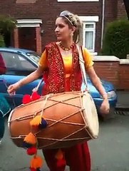 American girl palying Nashik Dhol
