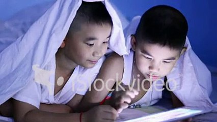 Funny Little Boy Using Digital Tablet