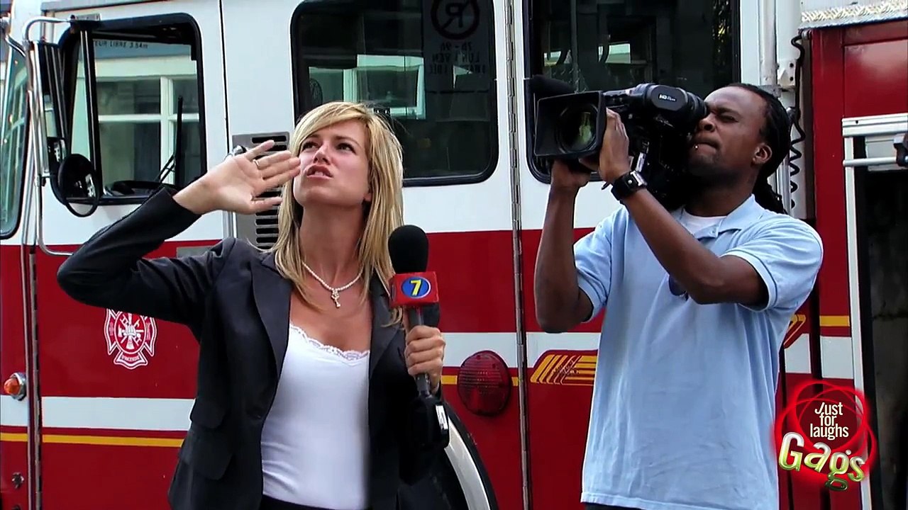 Fireman Interviewed While Building Burns