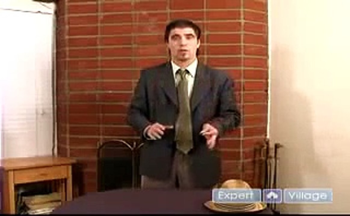 How to Do Magic Coin Tricks : Back Palm Coin Magic Trick