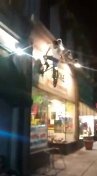FAIL Guy Tries Climb Onto Bicycle, Gets Knocked Out
