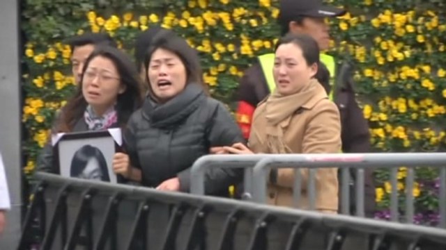 Familes mourn victims of Shanghai stampede amid close police scrutiny
