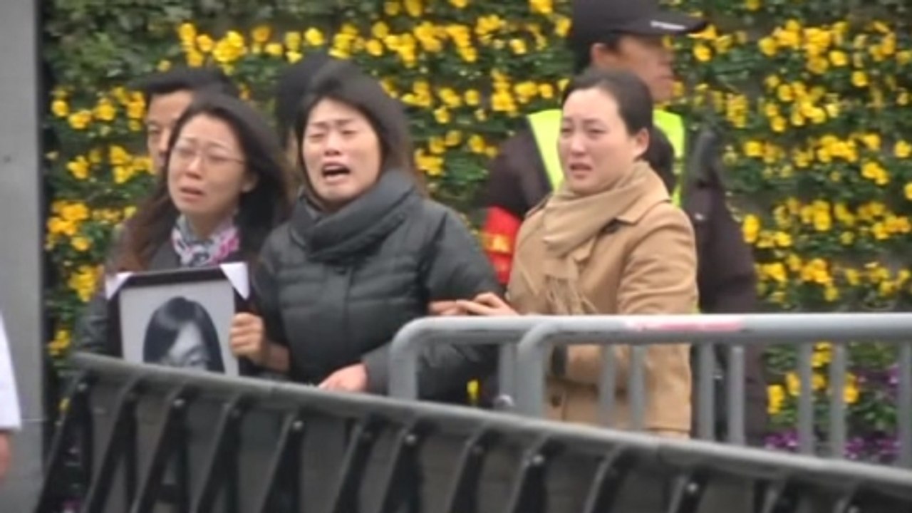 Familes mourn victims of Shanghai stampede amid close police scrutiny