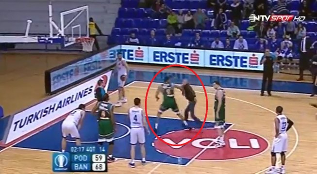 Basketballer takes down court invader with brutal WWE move