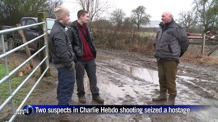 Locals watch as Paris massacre suspects cornered