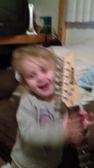 Cute Kid Playing Guitar At Age Of 2